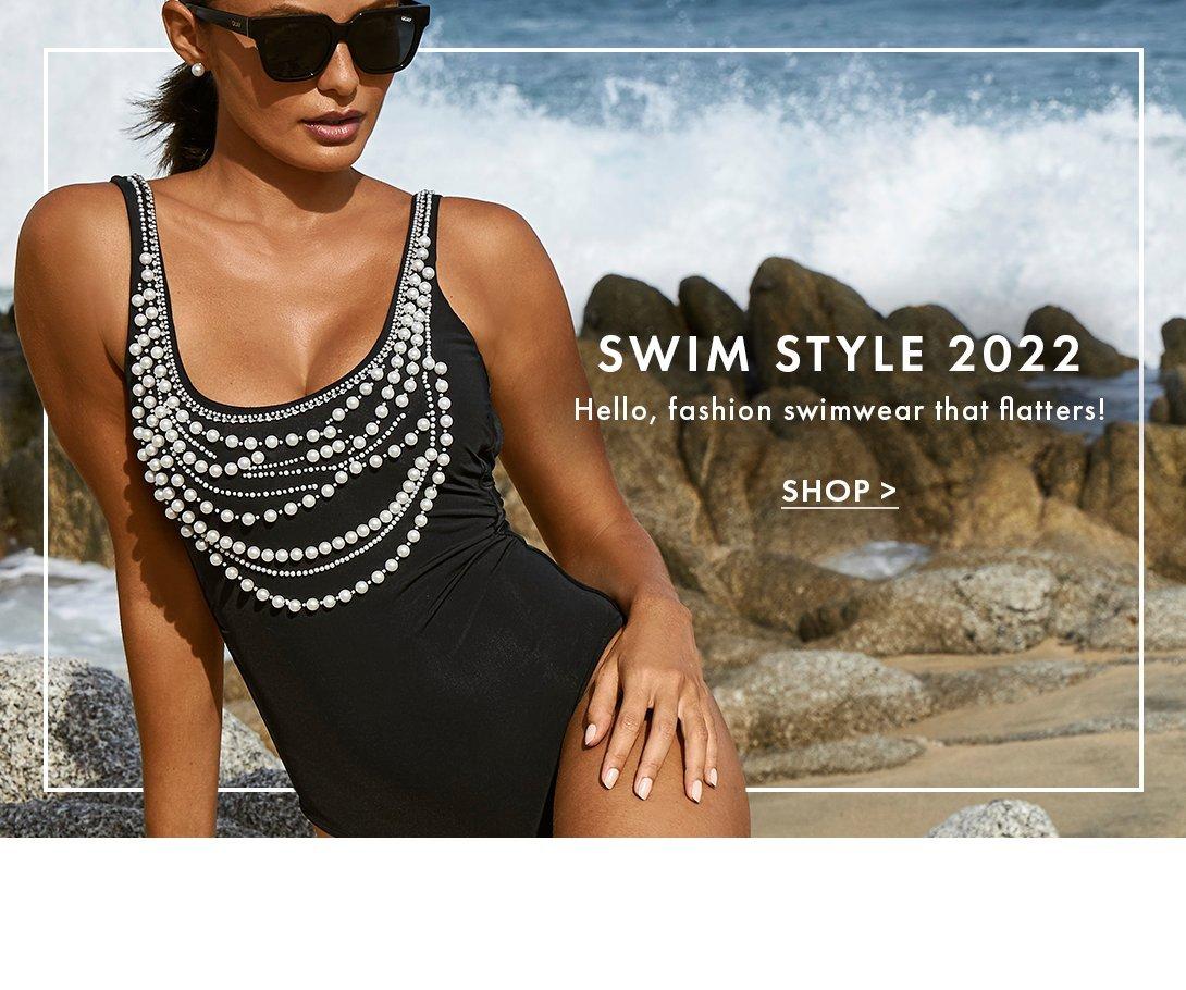 model wearing a pearl embellished black one-piece swimsuit and sunglasses.