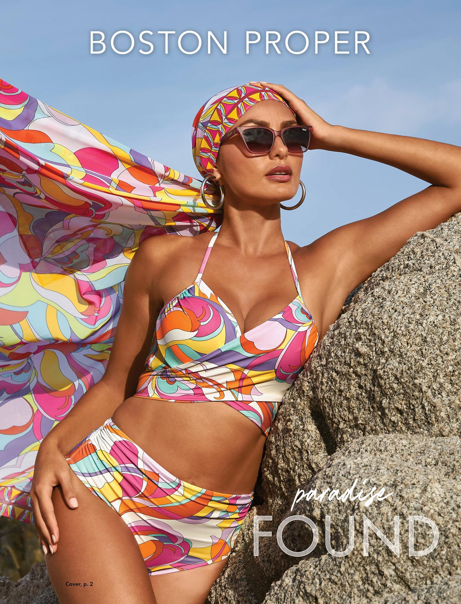 model wearing a paisley print multicolored bikini, matching head wrap, sunglasses, and silver hoop earrings.