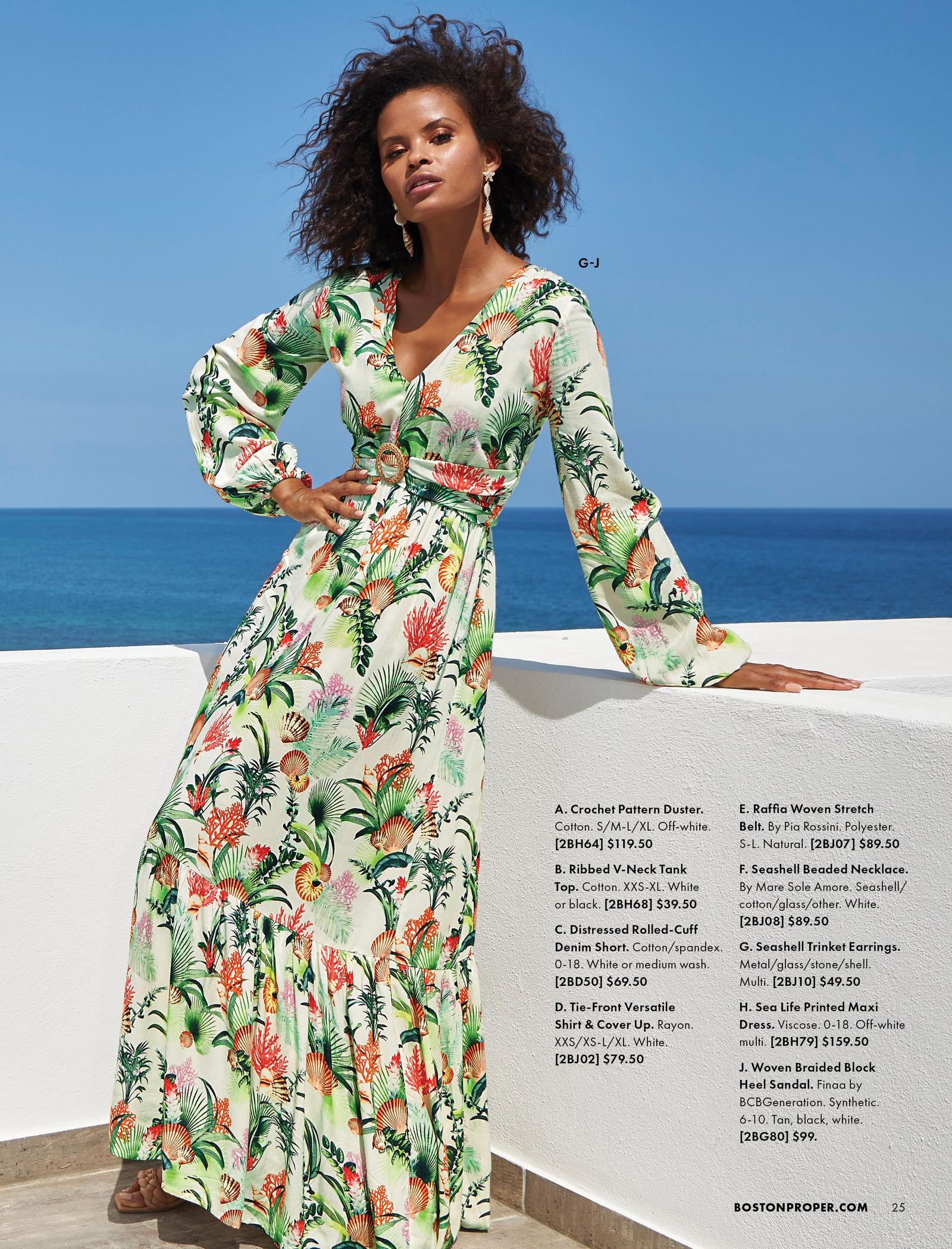 model wearing a tropical print long-sleeve v-neck belted maxi dress.