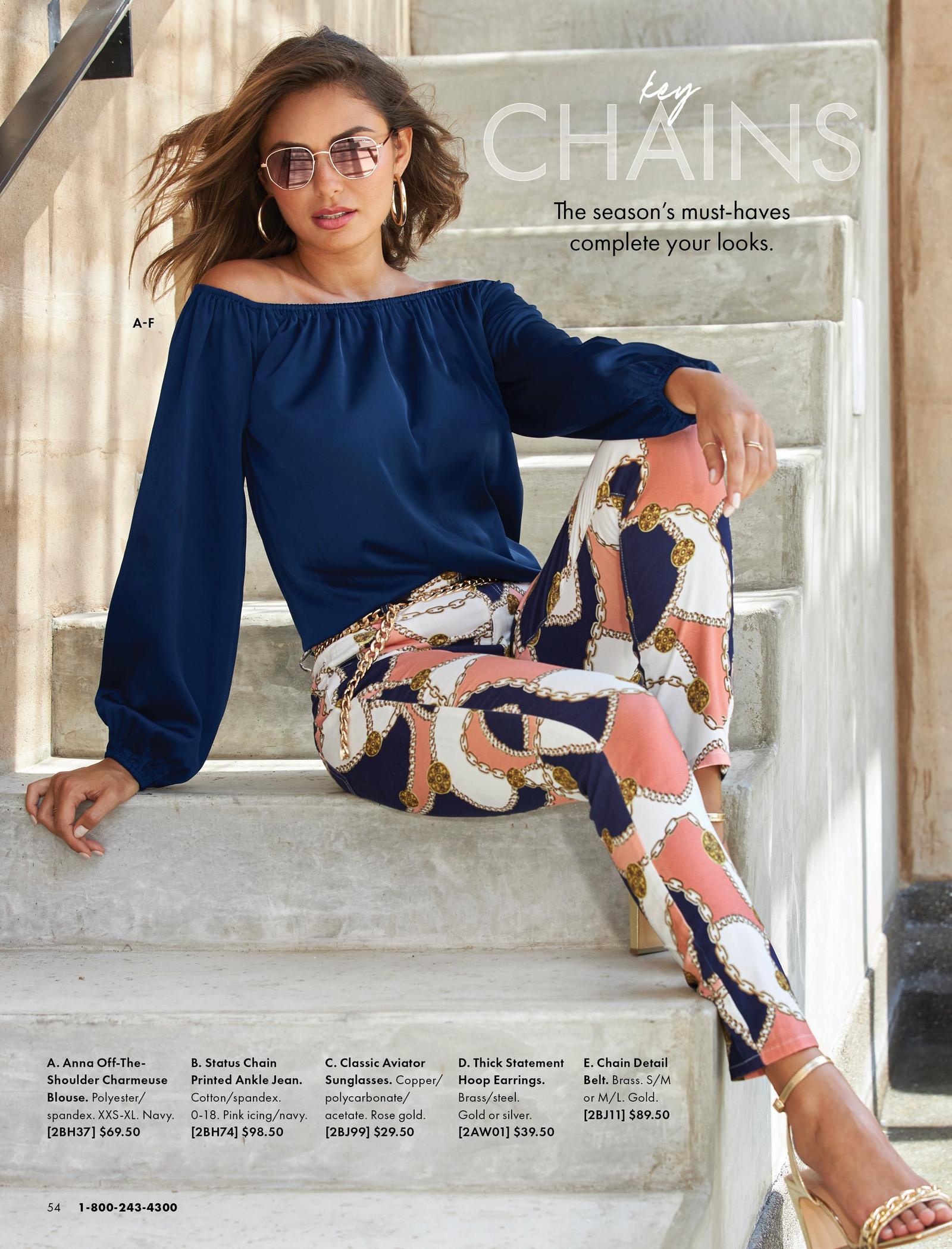 model wearing a navy off-the-shoulder balloon sleeve blouse, status print multicolored pants, tan wedges, mirrored aviator sunglasses, and silver hoop earrings.