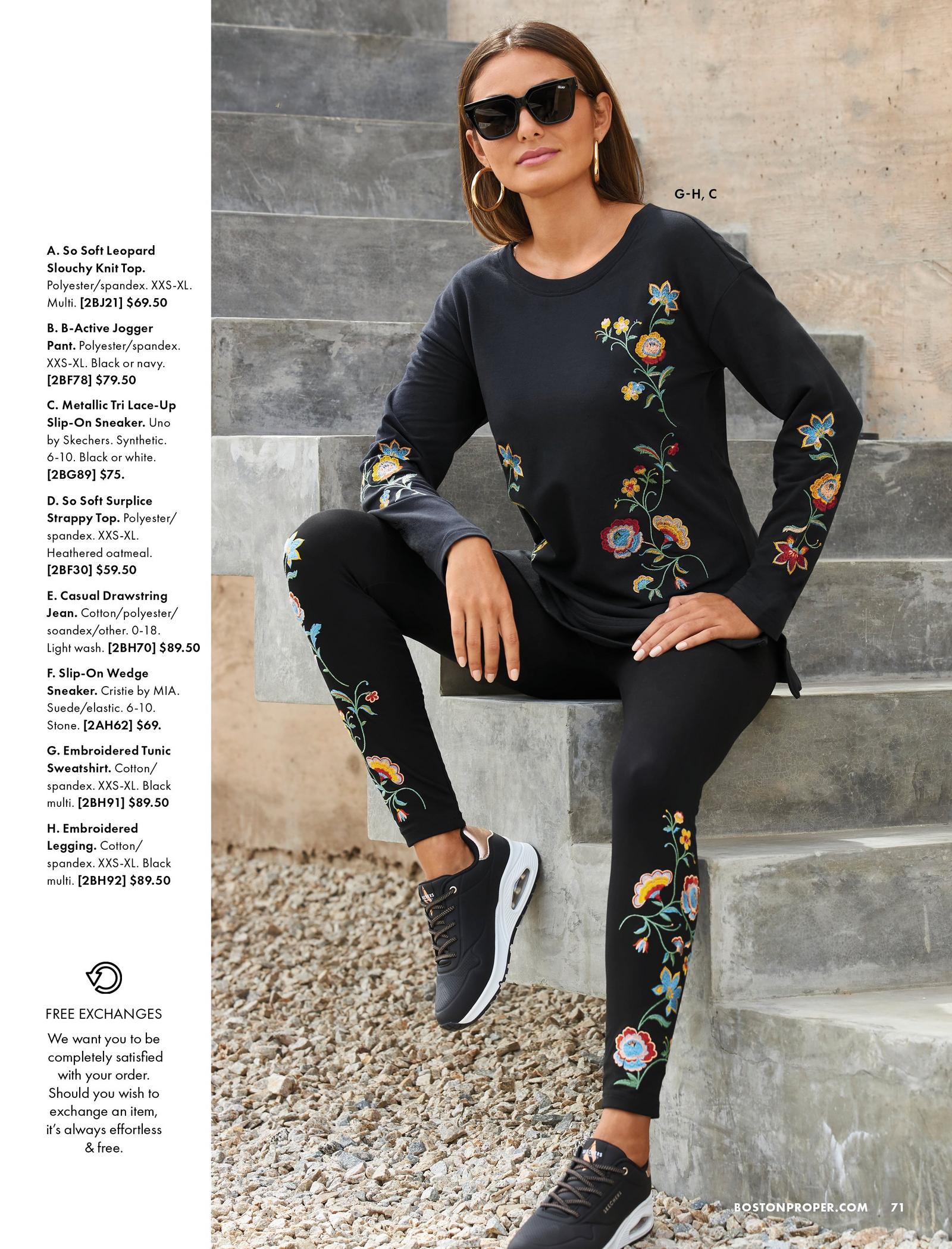 model wearing a black floral embroidered sweatshirt, black floral embroidered leggings, black sneakers, gold hoop earrings, and sunglasses.