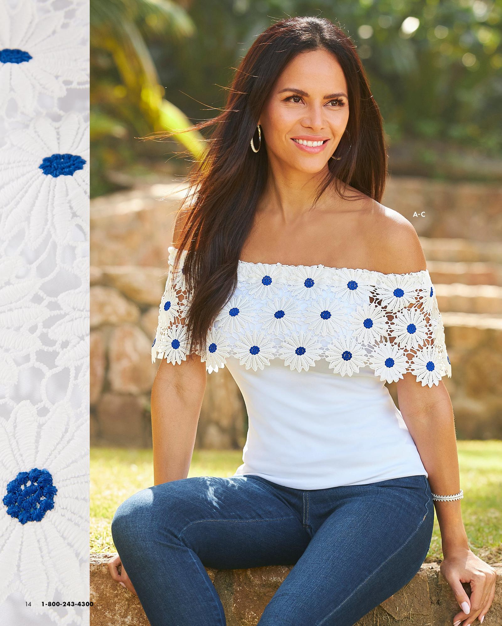 model wearing a white daisy lace embellished off-the-shoulder top, dark wash jeans, and silver hoop earrings.