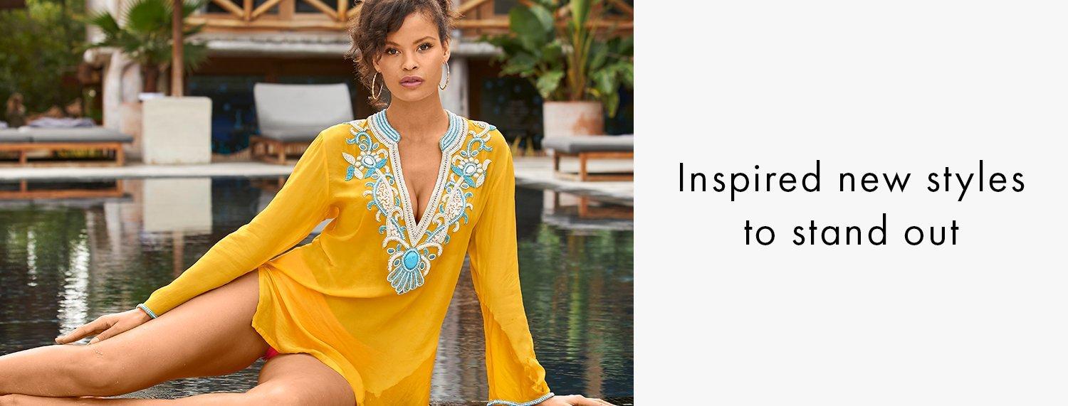 model wearing a yellow turquoise stone embellished long-sleeve tunic top.
