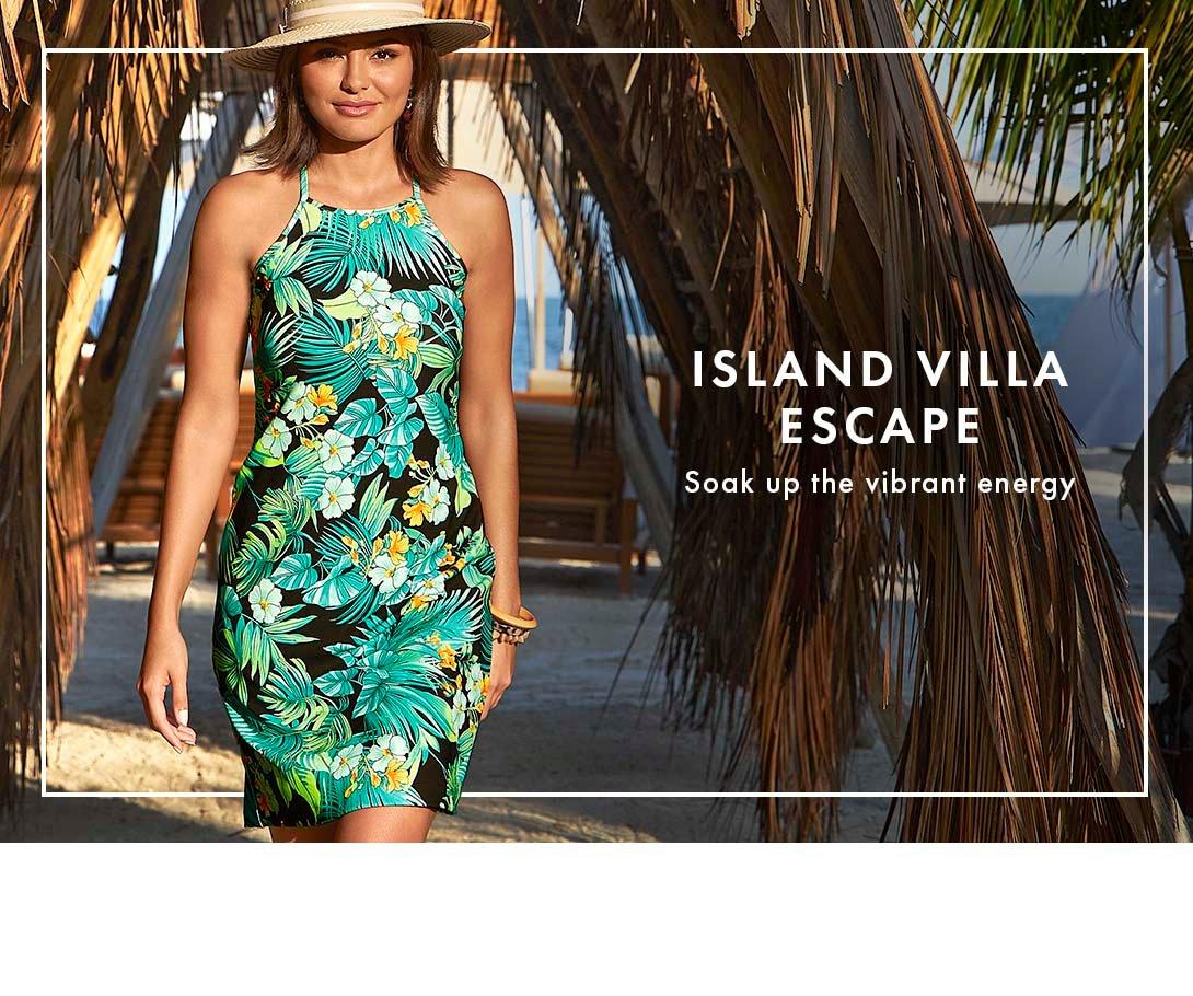 model wearing a green and black palm frond print high-neck sleeveless short dress and hat.