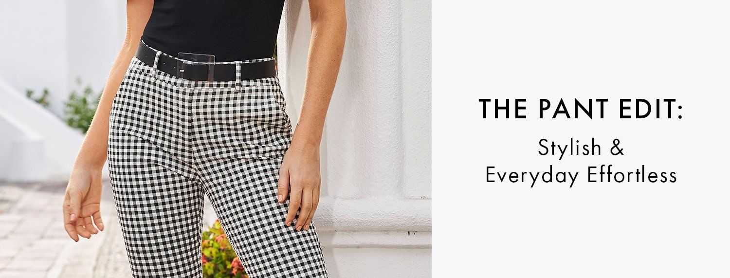 new pants model wearing black and white gingham pants, black belt, and black top.
